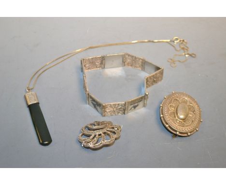 A silver bracelet; a silver and jade pendant; two silver brooches