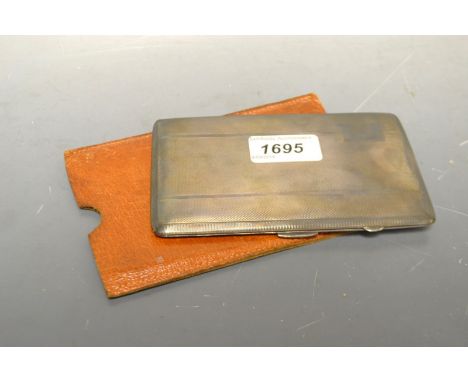 A silver rounded rectangular cigarette case, engine turned, vacant cartouche, the interior with presentation inscription for 