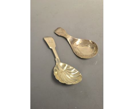 A George III Bright-cut silver caddy spoon, probably Thomas Willmore, Birmingham [obscured date letter]; a George IV silver c