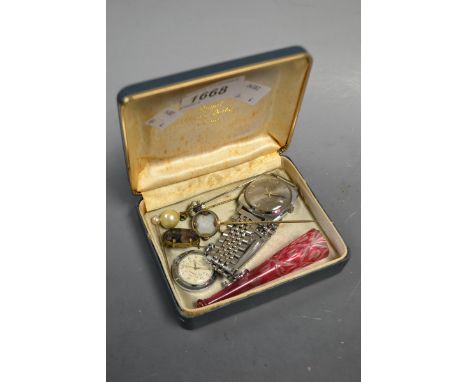 A Blue John oval polished cabochon brooch, 2cm x 1.5cm; a Bohemian glass ruby flashed cheroot holder; a novelty tambourine pi