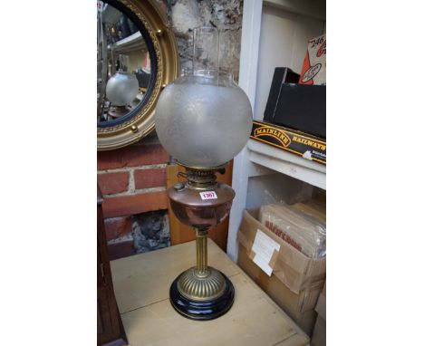 An old copper and brass oil lamp. 