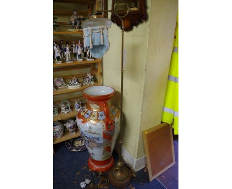 An old brass standard lamp. 