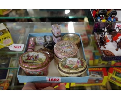 A small collection of antique enamel boxes;&nbsp;together with two agate examples; and a painted ivory example.&nbsp; 