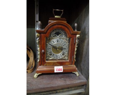 A small 18th century style walnut mantel clock,&nbsp;24cm high.&nbsp; 