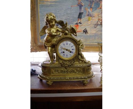 A late 19th century gilt metal mantel clock, the enamel inscribed 'Monbro Fils Anie, Paris', 40cm high. 