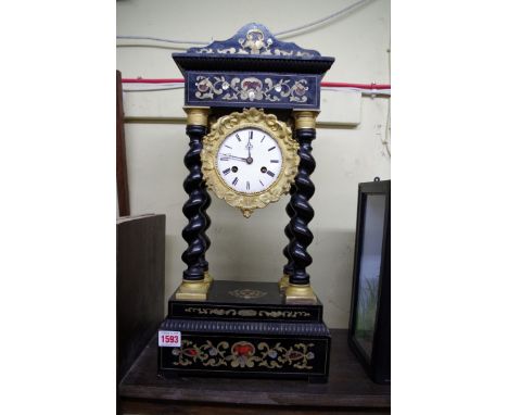 A 19th century ebonized, brass and tortoiseshell inlaid portico clock,&nbsp;50cm high.&nbsp; 