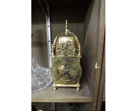 A small brass lantern style clock by Smiths,&nbsp;25cm high.&nbsp; 