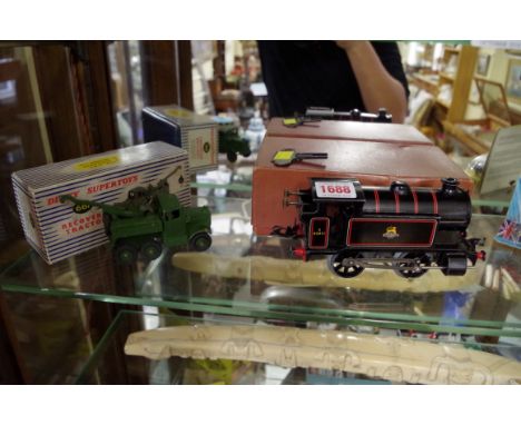 A Hornby O gauge clockwork 101 Tank Locomotive (reversing), boxed and with original Meccano winding key; together with a Dink