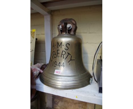 A large ship's bell,&nbsp;inscribed H.M.S. Liberty 1944', total height 34cm, with clapper. 