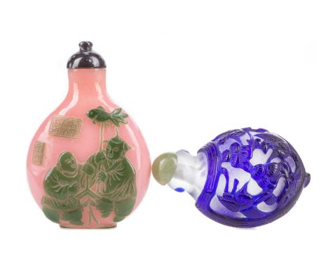 TWO CHINESE PEKING-TYPE CAMEO GLASS SNUFF BOTTLES,the larger with two figures to either side and seal mark to body in green a