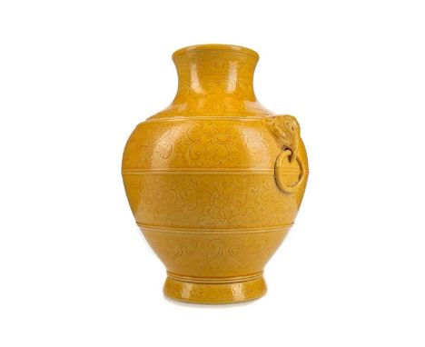 CHINESE YELLOW MONOCHROME VASE,with twin elephant mask and ring handles, incsided with bands of lotus and further floral bloo