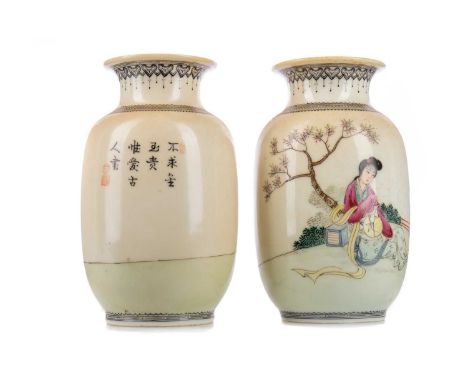 PAIR OF CHINESE OVOID VASES,decorated in the Republic manner with ladies sat in a walled gardens, black borders, pseudo-Qianl
