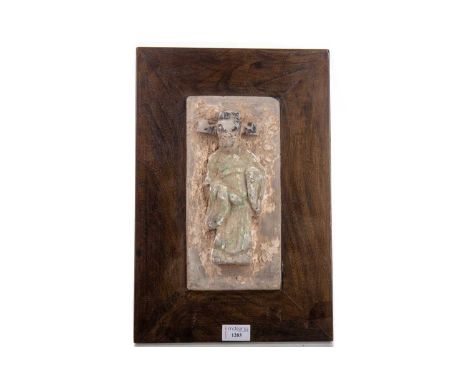 CHINESE POTTERY FIGURAL ARCHITECTURAL OR FUNERARY TILE,Ming dynasty, modelled as an official in court robes, retaining partia