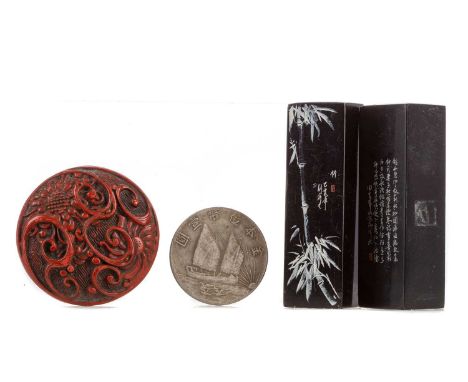 CHINESE CINNABAR LACQUER SEAL BOX,carved in relief with lotus blooms and scrolls, oracle script character mark to base, 5.5cm