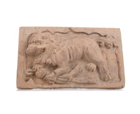 JIN DYNASTY (1127-1235) CHINESE TOMB TILE,moulded with a passant foo dog, 16.5cm x 27.5cmNote: Presented with paperwork and r