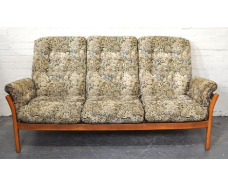 Ercol light elm three seat settee, floral pattern loose cushions, length 192cm, height 96cm.