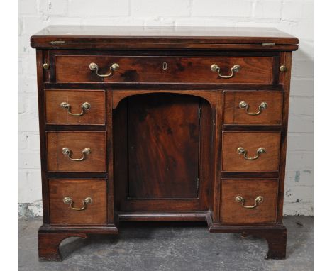 Early Victorian mahogany kneehole desk, rectangular part fold-over top with a moulded edge, seven drawers surrounding the kne