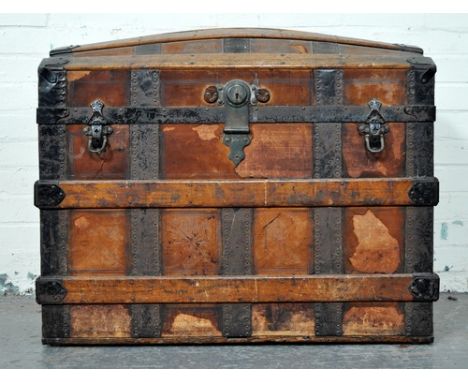 Stained and cross covered domed top trunk, oak slats, width 82cm, depth 53cm, height 68cm.