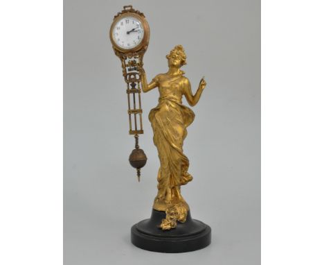 Edwardian gilt wood and metal mystery mantel clock, designed as a lady holding a mace, the enamel clock dial approximately 5m
