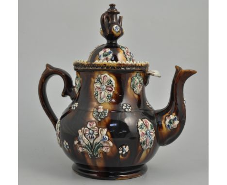Measham bargeware teapot, dated 1892, with stand, height 33cms and a Victorian Staffordshire pottery jardiniere, (2).