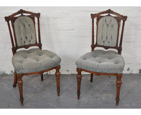 Pair of Victorian walnut salon chairs, carved and fluted frames,bowfront seats, turned and fluted, button upholstery, width 4