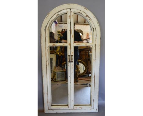 An Arch Framed Cream Painted Wall Mirror in the form of a Window, 146 x 75 cms