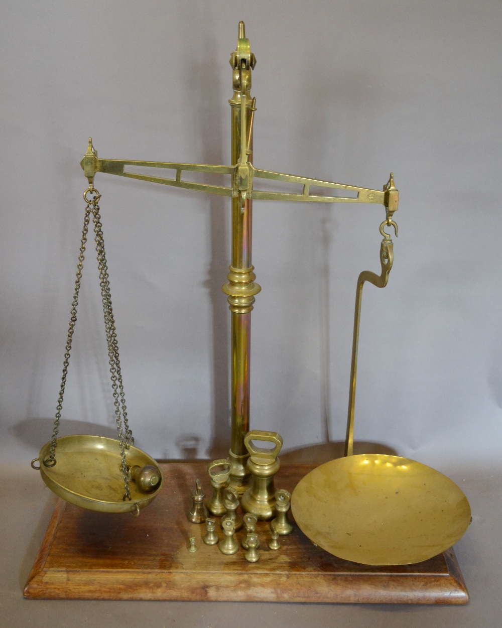 A Pair of Large Brass Balance Scales with rectangular wooden base