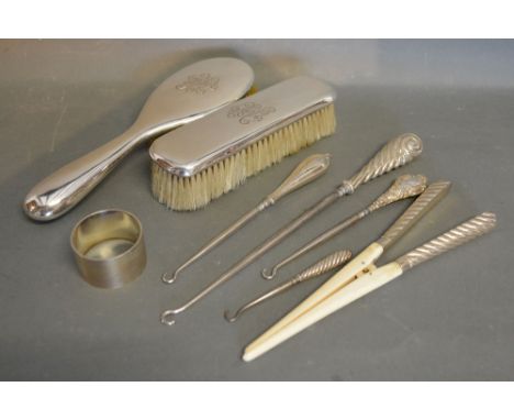 An 800 Mark Two Piece Silver Backed Dressing Table Set, together with a pair of silver handled and bone glove stretchers, fou