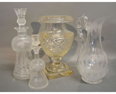 A Scottish Glass Decanter of Thistle Form together with another similar smaller, a glass vase and a glass jug