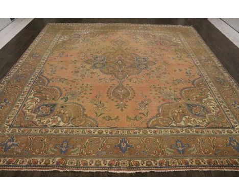 A North West Persian Woollen Carpet with a central medallion upon a terracotta and blue ground within multiple borders, 330 x