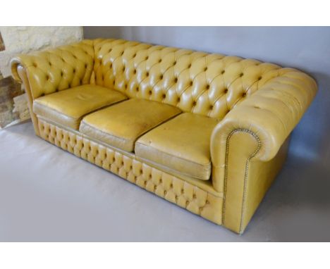 A Beige Leather Button Upholstered Chesterfield Sofa with Scroll Arms, 207 cms wide