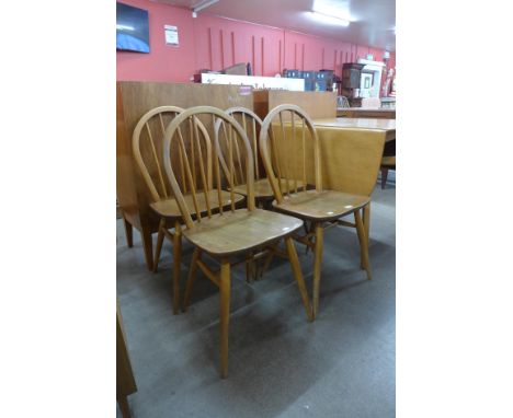 A set of four Ercol Blonde elm and beech Windsor chairs 