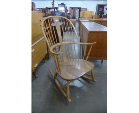 An Ercol Blonde elm and beech Chairmakers armchair 