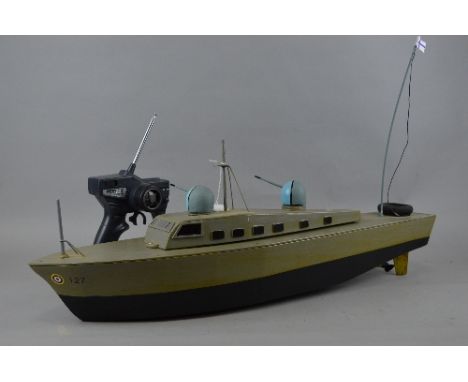 A WOODEN SCRATCH OR KIT BUILT RADIO CONTROL MODEL R.A.F. RESCUE/PATROL BOAT, not tested, constructed and painted to a good st