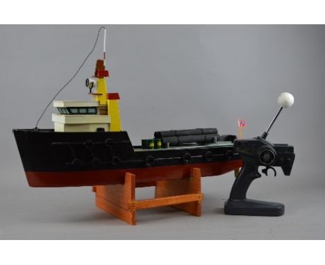 A WOODEN SCRATCH OR KIT BUILT RADIO CONTROL MODEL TUG BOAT, 'Girling', not tested, constructed and painted to a good standard