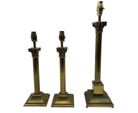 Pair of brass Corinthian column table lamps on square bases together with another similar lamp all with shades max H52cm