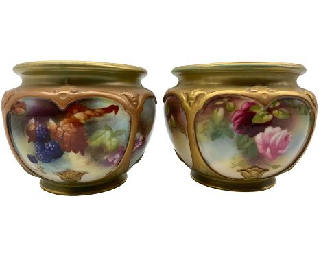 Two early 20th century Royal Worcester cache pots, of compressed form, each with four hand painted panels within gilt strapwo