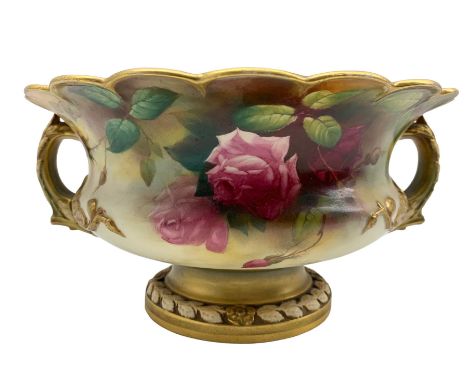 Early 20th century Royal Worcester twin handled footed bowl of squat baluster form with scalloped rim, hand painted with rose