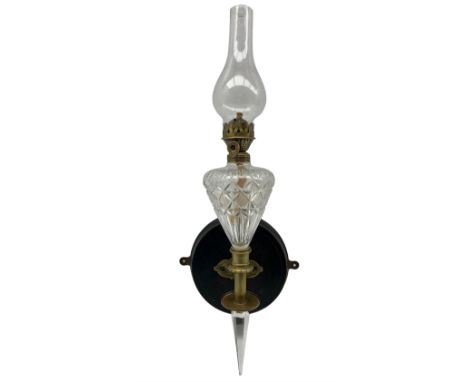 Edwardian wall mounted oil lamp, with brass mounts and oil reservoir of graduated form H57cm