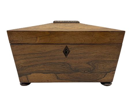 Regency rosewood sarcophagus shape tea caddy, the interior with two lidded compartments and on compressed bun feet L23cm 