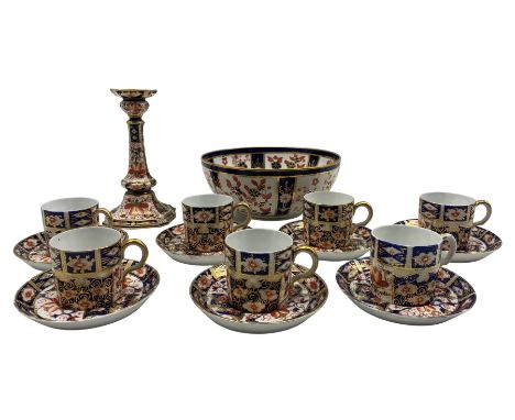 Seven Royal Crown Derby coffee cans and saucers in Imari pattern No2451, circa 1900, matching candlestick H17cm and a bowl Pa