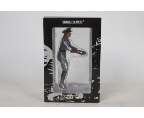 Minichamps - A boxed 1:12 scale T.E. Lawrence figurine in motorcycle riding position # 321350. This resin model appears in Mi