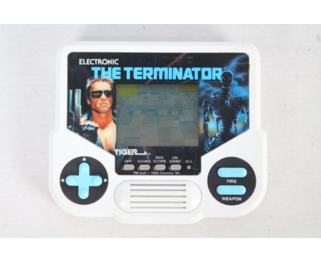 Tiger - A vintage hand held Electronic The Terminator console in working order. It shows some signs of age and use and appear