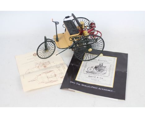 Franklin Mint - A 1:8 scale 1886 Benz Patent Motor Wagen. The model appears Mint in its original styrofoam packaging and has 