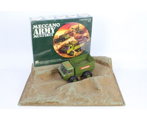 Meccano - A 1975 Meccano Shop Display Stand with a lorry and a factory sealed Army Multikit Construction Set. The decorated m