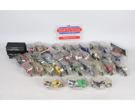 Maisto - 65 blister packed motorcycle models in 1:18 scale including a KTM Duke, Suzuki RM 250, Triumph TT 600 and other simi