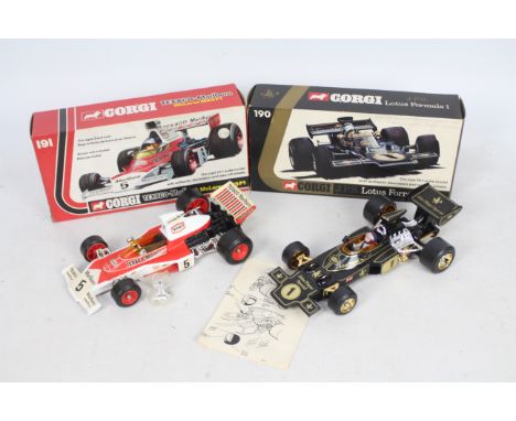 Corgi - 2 x 1:18 scale cars, a Lotus JPS F1 # 190 and a McLaren Texaco-Marlboro M23 F1 # 191. Both models appear Near Mint wi