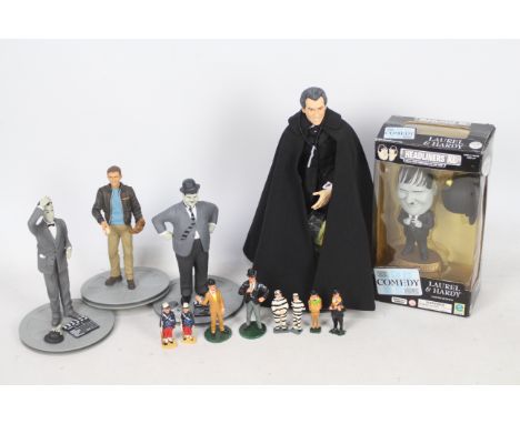 SD Toys - Headliners - RWA -  A collection of 11 Laurel and Hardy figures, a Chad McQueen figure and an 11" Christopher Lee f