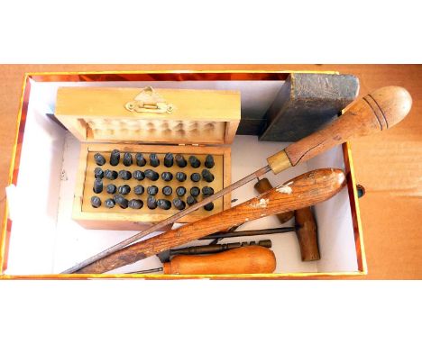 Letter stamping / embossing set in a box with other old tools.
