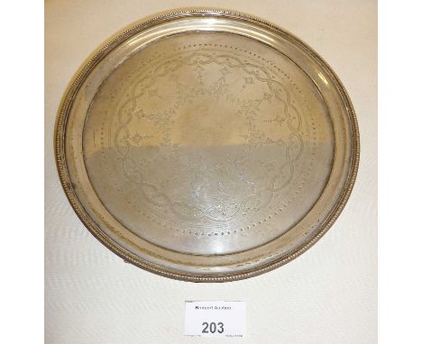 Circular silver salver with engraved foliate decoration Hallmarked for London 1884, maker William Hutton &amp; Sons, approx d